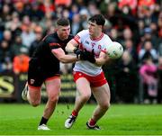 24 May 2025; Padraig McGrogan of Derry iis dispossed by Tiernan Kelly of Armagh during the GAA Football All-Ireland Senior Championship Round 1 match between Armagh and Derry at the BOX-IT Athletic Grounds in Armagh. Photo by Ray McManus/Sportsfile