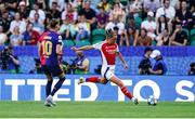 24 May 2025; Katie McCabe of Arsenal in action against Caroline Graham of Barcelona during the UEFA Women's Champions League final match between Arsenal and Barcelona at Estádio José Alvalade in Lisbon, Portugal. Photo by Daniela Porcelli /Sportsfile