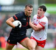 24 May 2025; Rian O'Neill of Armagh in action against Padraig McGrogan of Derry during the GAA Football All-Ireland Senior Championship Round 1 match between Armagh and Derry at the BOX-IT Athletic Grounds in Armagh. Photo by Ray McManus/Sportsfile