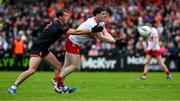 24 May 2025; Padraig McGrogan of Derry in action against Barry McCambridge of Armagh during the GAA Football All-Ireland Senior Championship Round 1 match between Armagh and Derry at the BOX-IT Athletic Grounds in Armagh. Photo by Ray McManus/Sportsfile