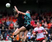 24 May 2025; Derry goalkeeper Ben McKinless and Andrew Murnin of Armagh contest a dropping ball during the GAA Football All-Ireland Senior Championship Round 1 match between Armagh and Derry at the BOX-IT Athletic Grounds in Armagh. Photo by Ray McManus/Sportsfile