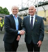 24 May 2025; DUP MLA for East Antrim and Minister for Communities Gordon Lyons, left, is welcomed by Michael Geoghegan President of the Ulster Council GAA before the GAA Football All-Ireland Senior Championship Round 1 match between Armagh and Derry at the BOX-IT Athletic Grounds in Armagh. Photo by Ray McManus/Sportsfile