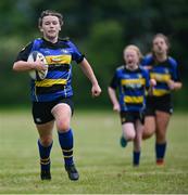 24 May 2025; Freya Corrigan of Moate, Westmeath, during the X Rugby 7s Girls match between Moate, Westmeath, and Fethard-Killusty, Tipperary, during day one of the Cairn Community Games Multi-Sports Finals 2025 at Gormanston Park in Meath. Photo by Shauna Clinton/Sportsfile