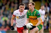 24 May 2025; Ciaran Thompson of Donegal in action against Michael McKernan of Tyrone during the GAA Football All-Ireland Senior Championship Round 1 match between Donegal and Tyrone at MacCumhaill Park in Ballybofey, Donegal. Photo by Ramsey Cardy/Sportsfile
