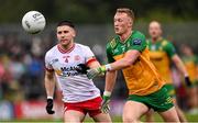 24 May 2025; Oisin Gallen of Donegal in action against Niall Devlin of Tyrone during the GAA Football All-Ireland Senior Championship Round 1 match between Donegal and Tyrone at MacCumhaill Park in Ballybofey, Donegal. Photo by Ramsey Cardy/Sportsfile