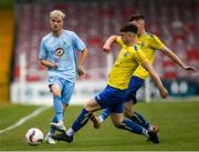 24 May 2025; Ayman Yousif of North End United is tackled by Brian Aherne of Fairview Rangers during the FAI Junior Cup final match between Fairview Rangers and North End United at Turner's Cross in Cork. Photo by Tom Beary/Sportsfile