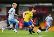 24 May 2025; Brian Aherne of Fairview Rangers in action against Robbie Kane of North End United during the FAI Junior Cup final match between Fairview Rangers and North End United at Turner's Cross in Cork. Photo by Tom Beary/Sportsfile