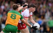24 May 2025; Ciaran Daly of Tyrone in action against Hugh McFadden, left, and Eoin McHugh of Donegal during the GAA Football All-Ireland Senior Championship Round 1 match between Donegal and Tyrone at MacCumhaill Park in Ballybofey, Donegal. Photo by Ramsey Cardy/Sportsfile