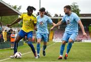 24 May 2025; Gbadebo Habideen of Fairview Rangers in action against Todd Hynes of North End United during the FAI Junior Cup final match between Fairview Rangers and North End United at Turner's Cross in Cork. Photo by Tom Beary/Sportsfile