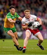 24 May 2025; Peter Harte of Tyrone in action against Odhran McFadden Ferry of Donegal during the GAA Football All-Ireland Senior Championship Round 1 match between Donegal and Tyrone at MacCumhaill Park in Ballybofey, Donegal. Photo by Ramsey Cardy/Sportsfile