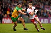 24 May 2025; Peter Harte of Tyrone in action against Odhran McFadden Ferry of Donegal during the GAA Football All-Ireland Senior Championship Round 1 match between Donegal and Tyrone at MacCumhaill Park in Ballybofey, Donegal. Photo by Ramsey Cardy/Sportsfile