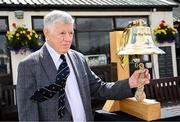 25 May 2025; Former Ireland international cricketer Brendan O'Brien rings the Roy Torrens Bell before match three of the One Day International Series between Ireland and the West Indies at Castle Avenue Cricket Ground in Dublin. Photo by Seb Daly/Sportsfile