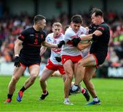 24 May 2025; Conor Doherty of Derry is taackled by Barry McCambridge of Armagh, supported by Oisin Conaty, left, during the GAA Football All-Ireland Senior Championship Round 1 match between Armagh and Derry at the BOX-IT Athletic Grounds in Armagh. Photo by Ray McManus/Sportsfile