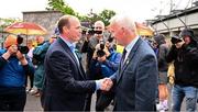 24 May 2025; DUP MLA for East Antrim and Minister for Communities Gordon Lyons, left, is welcomed by Michael Geoghegan President of the Ulster Council GAA before the GAA Football All-Ireland Senior Championship Round 1 match between Armagh and Derry at the BOX-IT Athletic Grounds in Armagh. Photo by Ray McManus/Sportsfile