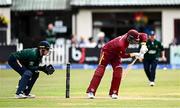 25 May 2025; West Indies batter Shai Hope plays a shot, watched by Ireland wicketkeeper Lorcan Tucker, during match three of the One Day International Series between Ireland and the West Indies at Castle Avenue Cricket Ground in Dublin. Photo by Seb Daly/Sportsfile
