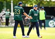 25 May 2025; Ireland players Liam McCarthy, left, and Cade Carmichael during match three of the One Day International Series between Ireland and the West Indies at Castle Avenue Cricket Ground in Dublin. Photo by Seb Daly/Sportsfile