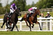 25 May 2025; Albert Einstein, with Ryan Moore up, left, races alongside Power Blue, with David Egan up, who finished second, on their way to winning the GAIN Marble Hill Stakes during day three of the Tattersalls Irish Guineas Festival at The Curragh Racecourse in Newbridge, Kildare. Photo by Thomas Doolin/Sportsfile