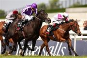 25 May 2025; Albert Einstein, with Ryan Moore up, left, races alongside Power Blue, with David Egan up, who finished second, on their way to winning the GAIN Marble Hill Stakes during day three of the Tattersalls Irish Guineas Festival at The Curragh Racecourse in Newbridge, Kildare. Photo by Thomas Doolin/Sportsfile