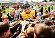 25 May 2025; Conor Foley of Wexford signs supporters' hurleys after his side's victory in the Leinster GAA Hurling Senior Championship Round 5 match between Wexford and Kilkenny at Chadwicks Wexford Park in Wexford. Photo by Thomas Flinkow/Sportsfile