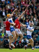 25 May 2025; Waterford players Sean Walsh, left, and Patrick Fitzgerald, and Cork players Eoin Downey, left, and Seán O’Donoghue contest the ball during the Munster GAA Hurling Senior Championship Round 5 match between Cork and Waterford at SuperValu Páirc Ui Chaoimh in Cork. Photo by Brendan Moran/Sportsfile