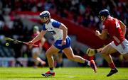25 May 2025; Stephen Bennett of Waterford races clear of Seán O’Donoghue of Cork during the Munster GAA Hurling Senior Championship Round 5 match between Cork and Waterford at SuperValu Páirc Ui Chaoimh in Cork. Photo by Brendan Moran/Sportsfile