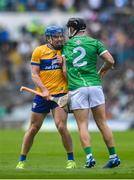 25 May 2025; Shane O'Donnell of Clare and Barry Murphy of Limerick tussle during the Munster GAA Hurling Senior Championship Round 5 match between Limerick and Clare at TUS Gaelic Grounds in Limerick. Photo by John Sheridan/Sportsfile