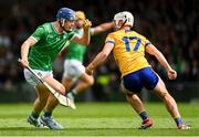 25 May 2025; Shane O'Brien of Limerick in action against Daithi Lohan of Clare during the Munster GAA Hurling Senior Championship Round 5 match between Limerick and Clare at TUS Gaelic Grounds in Limerick. Photo by Tom Beary/Sportsfile
