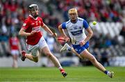 25 May 2025; Sean Walsh of Waterford in action against Ger Millerick of Cork during the Munster GAA Hurling Senior Championship Round 5 match between Cork and Waterford at SuperValu Páirc Ui Chaoimh in Cork. Photo by Brendan Moran/Sportsfile