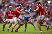 25 May 2025; Darragh Lyons of Waterford is tackled by Cork players Seán O’Donoghue, left, and Darragh Fitzgibbon during the Munster GAA Hurling Senior Championship Round 5 match between Cork and Waterford at SuperValu Páirc Ui Chaoimh in Cork. Photo by Brendan Moran/Sportsfile