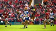 25 May 2025; Sean Walsh of Waterford races clear of Cormac O'Brien of Cork during the Munster GAA Hurling Senior Championship Round 5 match between Cork and Waterford at SuperValu Páirc Ui Chaoimh in Cork. Photo by Brendan Moran/Sportsfile