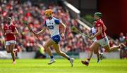 25 May 2025; Sean Walsh of Waterford races clear of Cormac O'Brien of Cork during the Munster GAA Hurling Senior Championship Round 5 match between Cork and Waterford at SuperValu Páirc Ui Chaoimh in Cork. Photo by Brendan Moran/Sportsfile