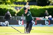 25 May 2025; Ireland batter Andrew Balbirnie is bowled out by West Indies bowler Jayden Seales during match three of the One Day International Series between Ireland and the West Indies at Castle Avenue Cricket Ground in Dublin. Photo by Seb Daly/Sportsfile
