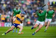 25 May 2025; Shane O'Donnell of Clare in action against Mike Casey of Limerick during the Munster GAA Hurling Senior Championship Round 5 match between Limerick and Clare at TUS Gaelic Grounds in Limerick. Photo by John Sheridan/Sportsfile