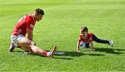 25 May 2025; Patrick Horgan of Cork stretches on the pitch with his son Jack after the Munster GAA Hurling Senior Championship Round 5 match between Cork and Waterford at SuperValu Páirc Ui Chaoimh in Cork. Photo by Piaras Ó Mídheach/Sportsfile