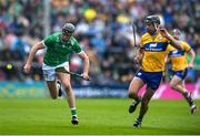 25 May 2025; Diarmaid Byrnes of Limerick in action against Cathal Malone of Clare during the Munster GAA Hurling Senior Championship Round 5 match between Limerick and Clare at TUS Gaelic Grounds in Limerick. Photo by John Sheridan/Sportsfile