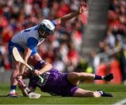 25 May 2025; Cork goalkeeper Patrick Collins is tackled by Stephen Bennett of Waterford during the Munster GAA Hurling Senior Championship Round 5 match between Cork and Waterford at SuperValu Páirc Ui Chaoimh in Cork. Photo by Piaras Ó Mídheach/Sportsfile