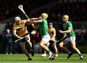 25 May 2025; Ryan Taylor of Clare is tackled by Tom Morrissey of Limerick during the Munster GAA Hurling Senior Championship Round 5 match between Limerick and Clare at TUS Gaelic Grounds in Limerick. Photo by Tom Beary/Sportsfile