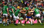 25 May 2025; Shane O'Donnell of Clare is tackled by Barry Murphy, left, and Declan Hannon of Limerick during the Munster GAA Hurling Senior Championship Round 5 match between Limerick and Clare at TUS Gaelic Grounds in Limerick. Photo by Tom Beary/Sportsfile
