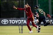 25 May 2025; West Indies bowler Roston Chase celebrates the wicket of Ireland batter Barry McCarthy, run-out by teammate Justin Greaves, not pictured, during match three of the One Day International Series between Ireland and the West Indies at Castle Avenue Cricket Ground in Dublin. Photo by Seb Daly/Sportsfile