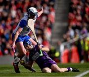 25 May 2025; Cork goalkeeper Patrick Collins is tackled by Stephen Bennett of Waterford during the Munster GAA Hurling Senior Championship Round 5 match between Cork and Waterford at SuperValu Páirc Ui Chaoimh in Cork. Photo by Piaras Ó Mídheach/Sportsfile