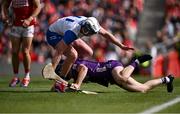 25 May 2025; Cork goalkeeper Patrick Collins is tackled by Stephen Bennett of Waterford during the Munster GAA Hurling Senior Championship Round 5 match between Cork and Waterford at SuperValu Páirc Ui Chaoimh in Cork. Photo by Piaras Ó Mídheach/Sportsfile