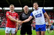 25 May 2025; Team captains Shane Barrett of Cork, left, and Conor Prunty of Waterford shake hands, in the company of referee Johnny Murphy, before during the Munster GAA Hurling Senior Championship Round 5 match between Cork and Waterford at SuperValu Páirc Ui Chaoimh in Cork. Photo by Brendan Moran/Sportsfile