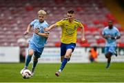 24 May 2025; Robbie Kane of North End United in action against Adam Dore of Fairview Rangers during the FAI Junior Cup final match between Fairview Rangers and North End United at Turner's Cross in Cork. Photo by Tom Beary/Sportsfile