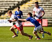 25 May 2025; Peter Colton of Tyrone in action against Donagh Lynch of Cavan during the Electric Ireland Ulster GAA Football Minor Championship final match between Cavan and Tyrone at Brewster Park in Enniskillen, Fermanagh. Photo by Oliver McVeigh/Sportsfile