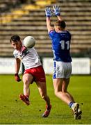 25 May 2025; Padraig Goodman of Tyrone in action against Jake Brady of Cavan during the Electric Ireland Ulster GAA Football Minor Championship final match between Cavan and Tyrone at Brewster Park in Enniskillen, Fermanagh. Photo by Oliver McVeigh/Sportsfile