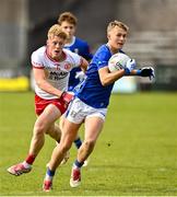 25 May 2025; Jake Brady of Cavan in action against Peter Colton of Tyrone during the Electric Ireland Ulster GAA Football Minor Championship final match between Cavan and Tyrone at Brewster Park in Enniskillen, Fermanagh. Photo by Oliver McVeigh/Sportsfile