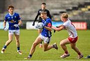 25 May 2025; Jake Brady of Cavan  in action against Peter Colton of Tyrone during the Electric Ireland Ulster GAA Football Minor Championship final match between Cavan and Tyrone at Brewster Park in Enniskillen, Fermanagh. Photo by Oliver McVeigh/Sportsfile