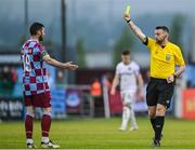 23 May 2025; Referee Declan Toland shows a yellow card to Ryan Brennan of Drogheda United during the SSE Airtricity Men's Premier Division match between Drogheda United and Bohemians at Sullivan & Lambe Park in Drogheda, Louth. Photo by Shauna Clinton/Sportsfile