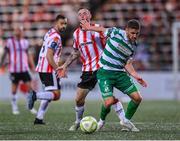 23 May 2025; Dylan Watts of Shamrock Rovers in action against Carl Winchester of Derry City during the SSE Airtricity Men's Premier Division match between Derry City and Shamrock Rovers at The Ryan McBride Brandywell Stadium in Derry. Photo by Stephen McCarthy/Sportsfile