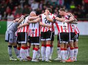 23 May 2025; Derry City players huddle before the SSE Airtricity Men's Premier Division match between Derry City and Shamrock Rovers at The Ryan McBride Brandywell Stadium in Derry. Photo by Stephen McCarthy/Sportsfile